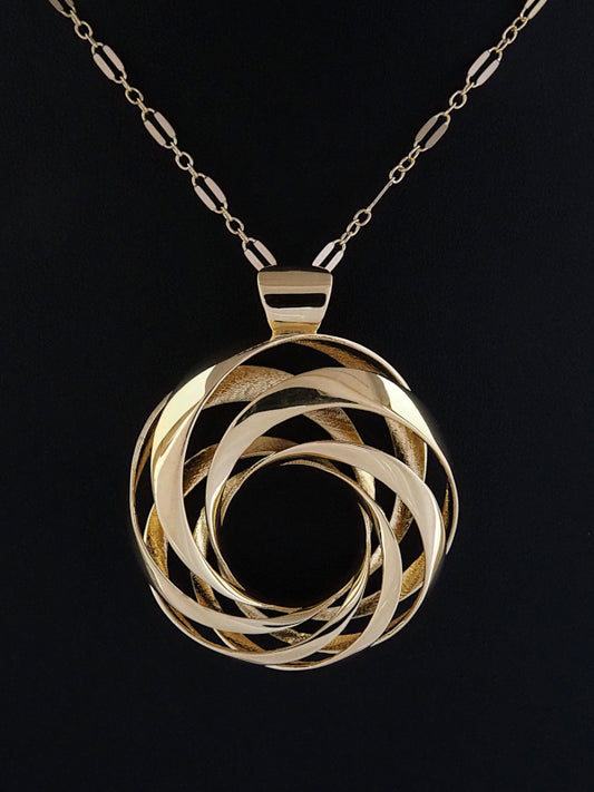 A 35mm gold-plated brass cyclide pendant on a gold long-and-short loop chain.
