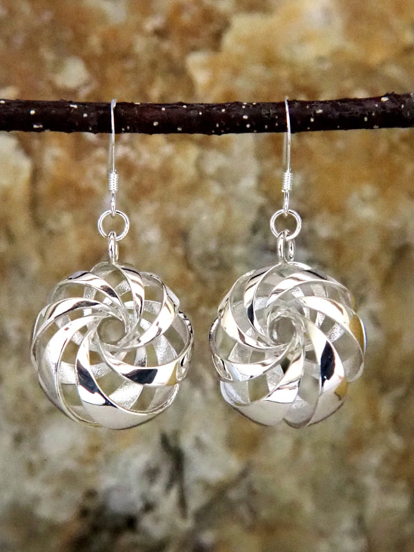 A pair of sterling silver cyclide earrings.