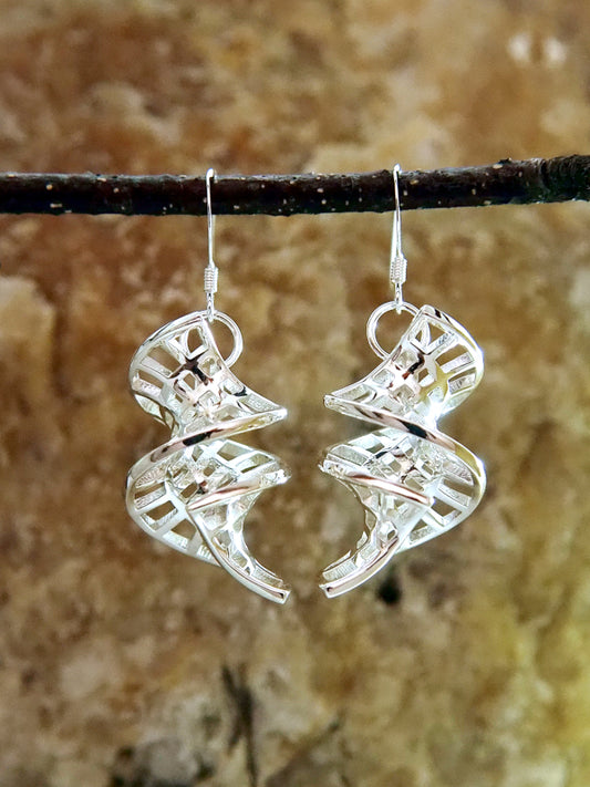 A pair of sterling silver helicoid-catenoid earrings.